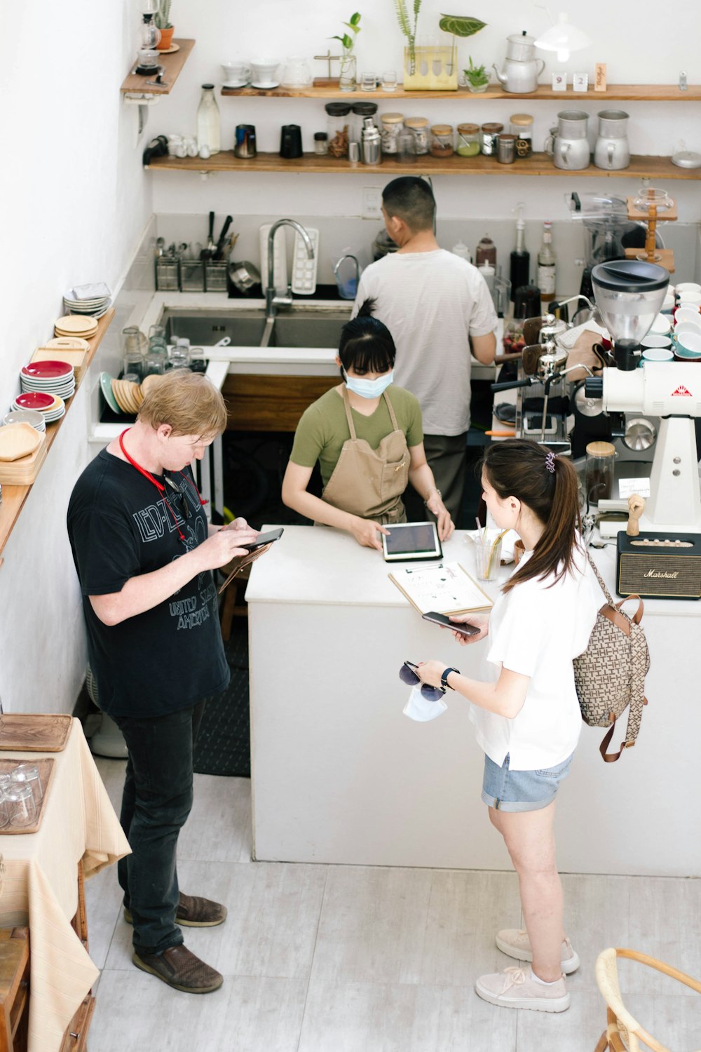 woman in white shirt standing beside woman in black shirt