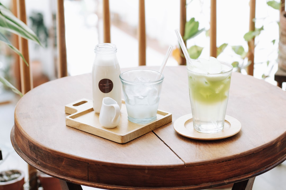 2 clear drinking glasses on white table