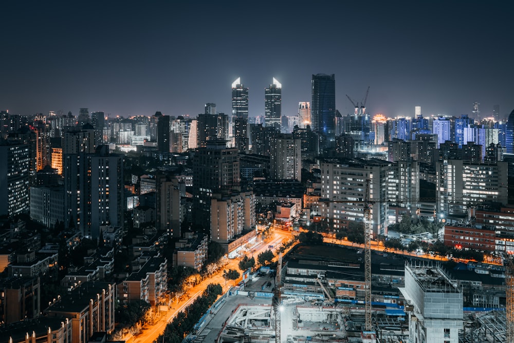 city with high rise buildings during night time