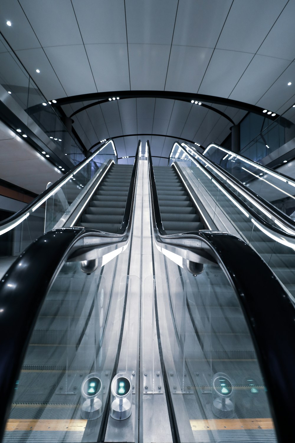 black and white escalator inside building