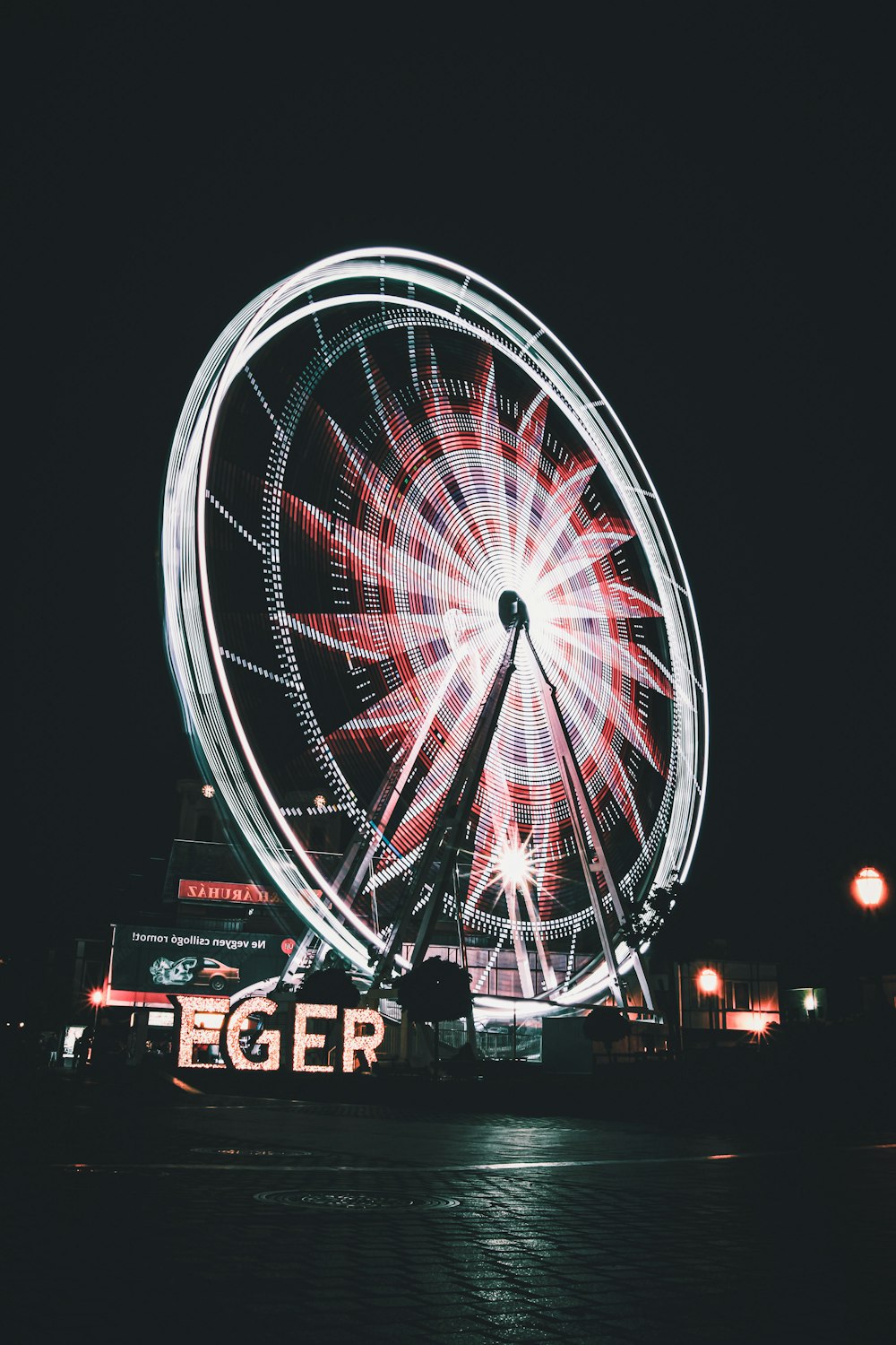 ferris wheel with lights turned on during night time