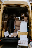 A shipping company van ready for delivery with packages.