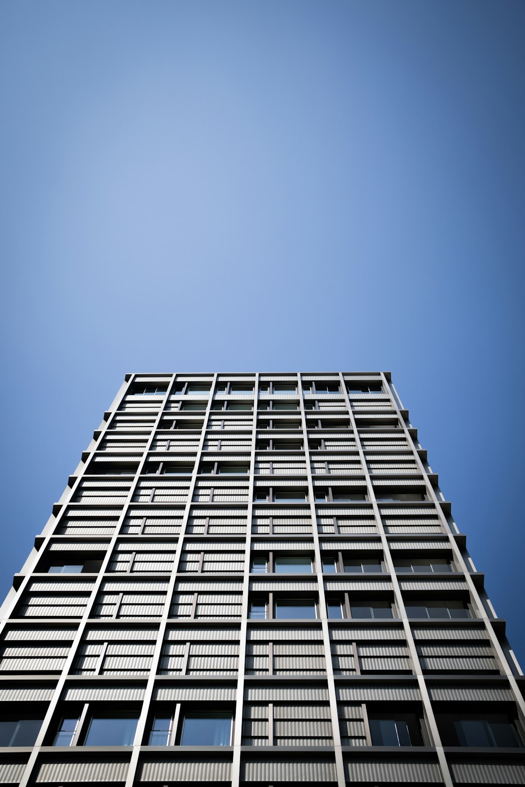 white concrete building under blue sky during daytime