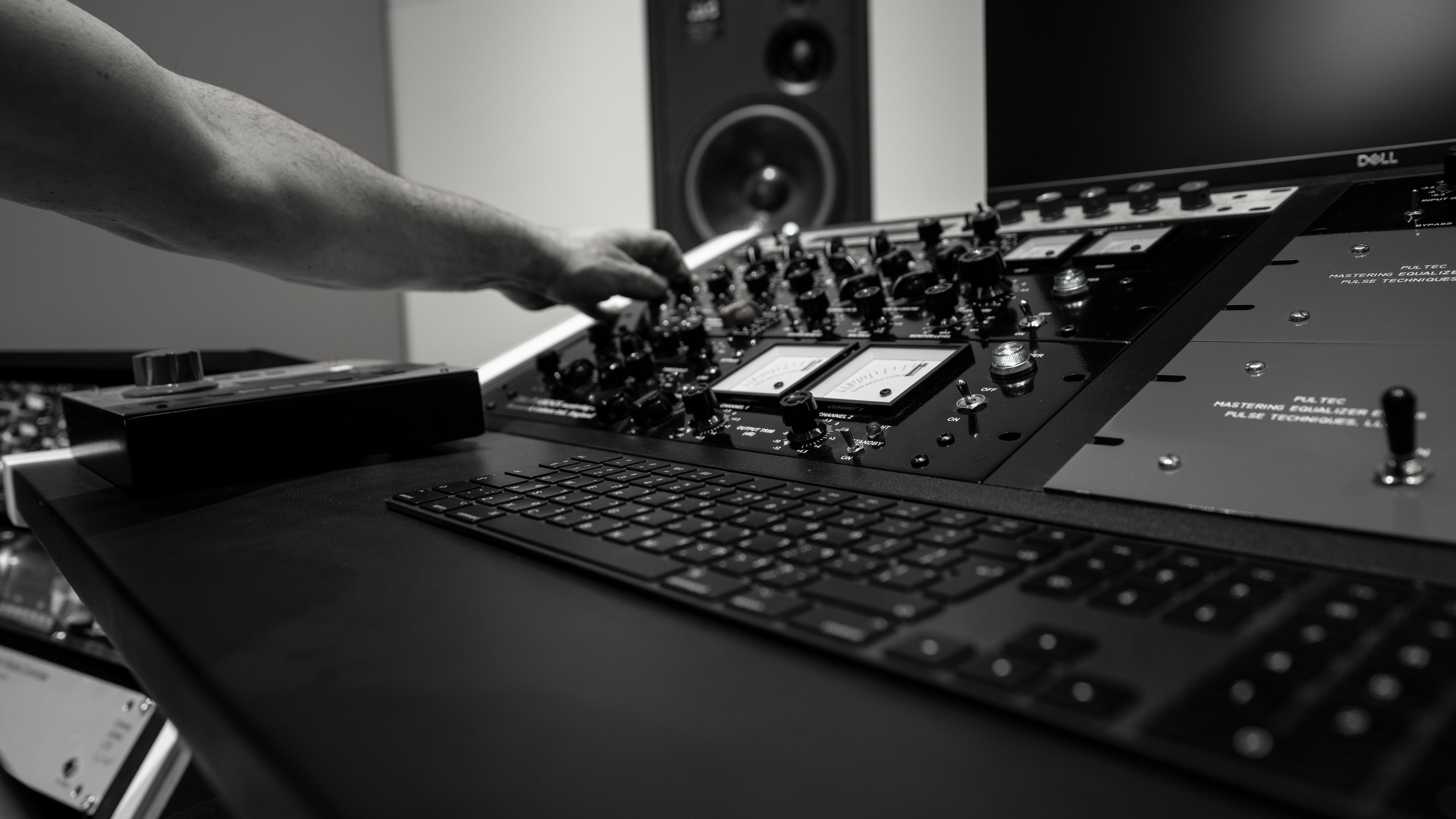 person holding black audio mixer