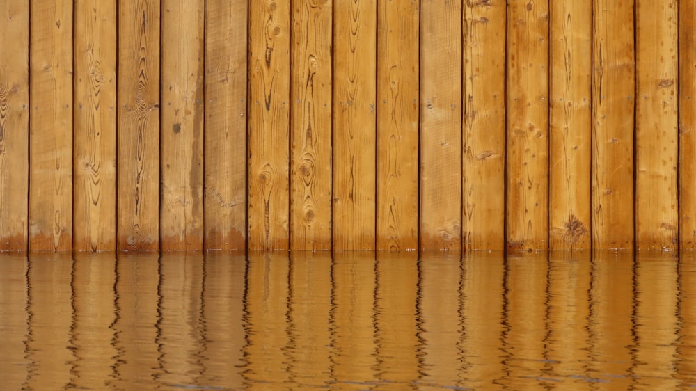 brown wooden wall with water