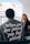 man in gray crew neck t-shirt sitting beside woman in black shirt