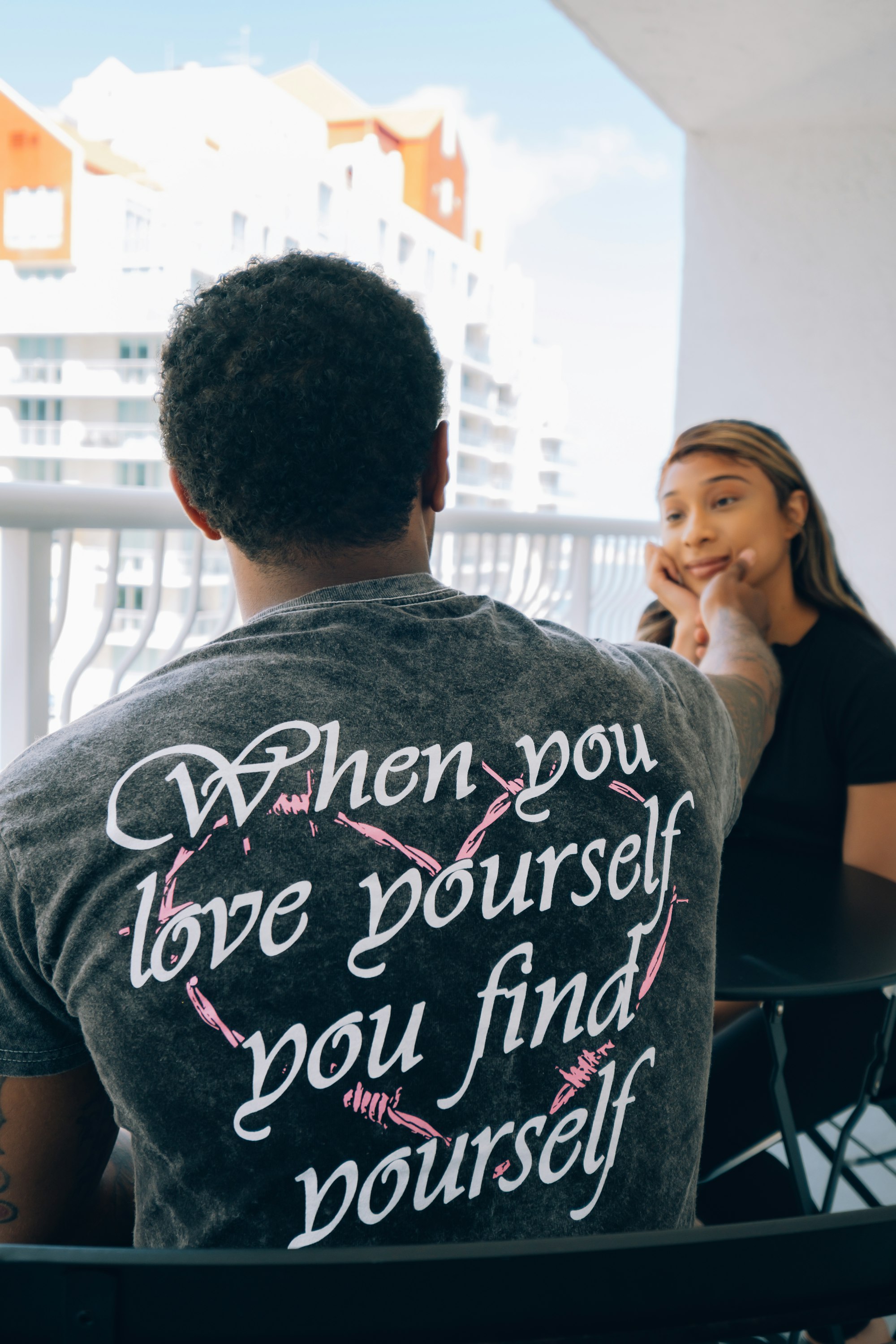 Man touching a woman's face, lovingly. 