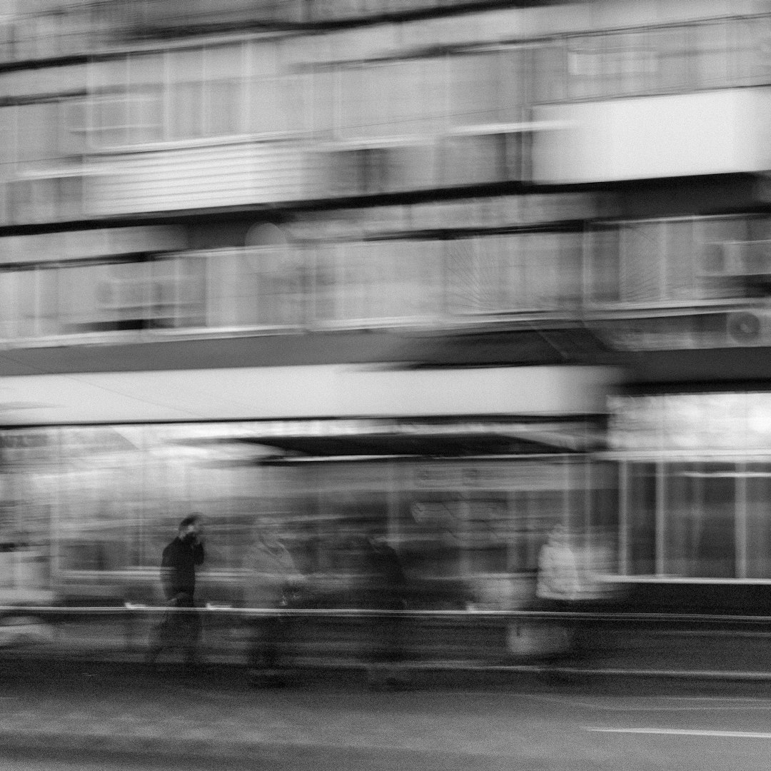 grayscale photo of people walking on street