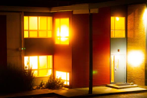 Evening exterior of a building illuminated by energy-efficient automated lighting systems