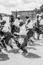 grayscale photo of people walking on street