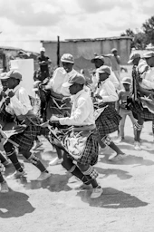grayscale photo of people walking on street