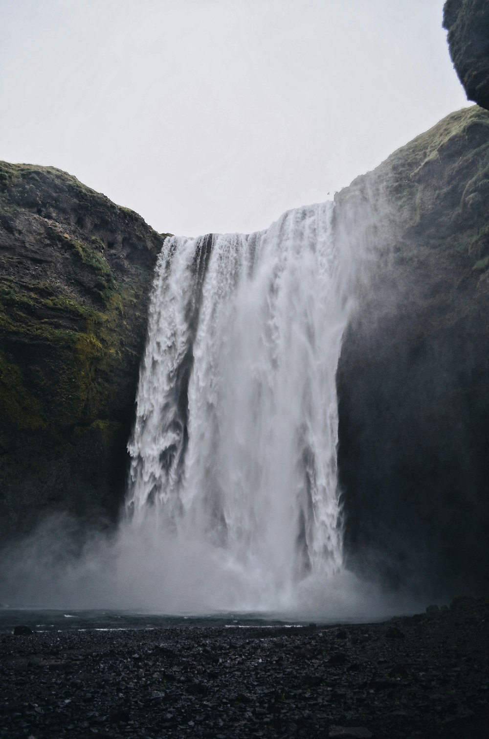 waterfalls on green and brown mountain