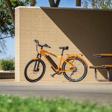 Photo of a bright and colorful electric cargo bike parked in a sunny Moroccan street.