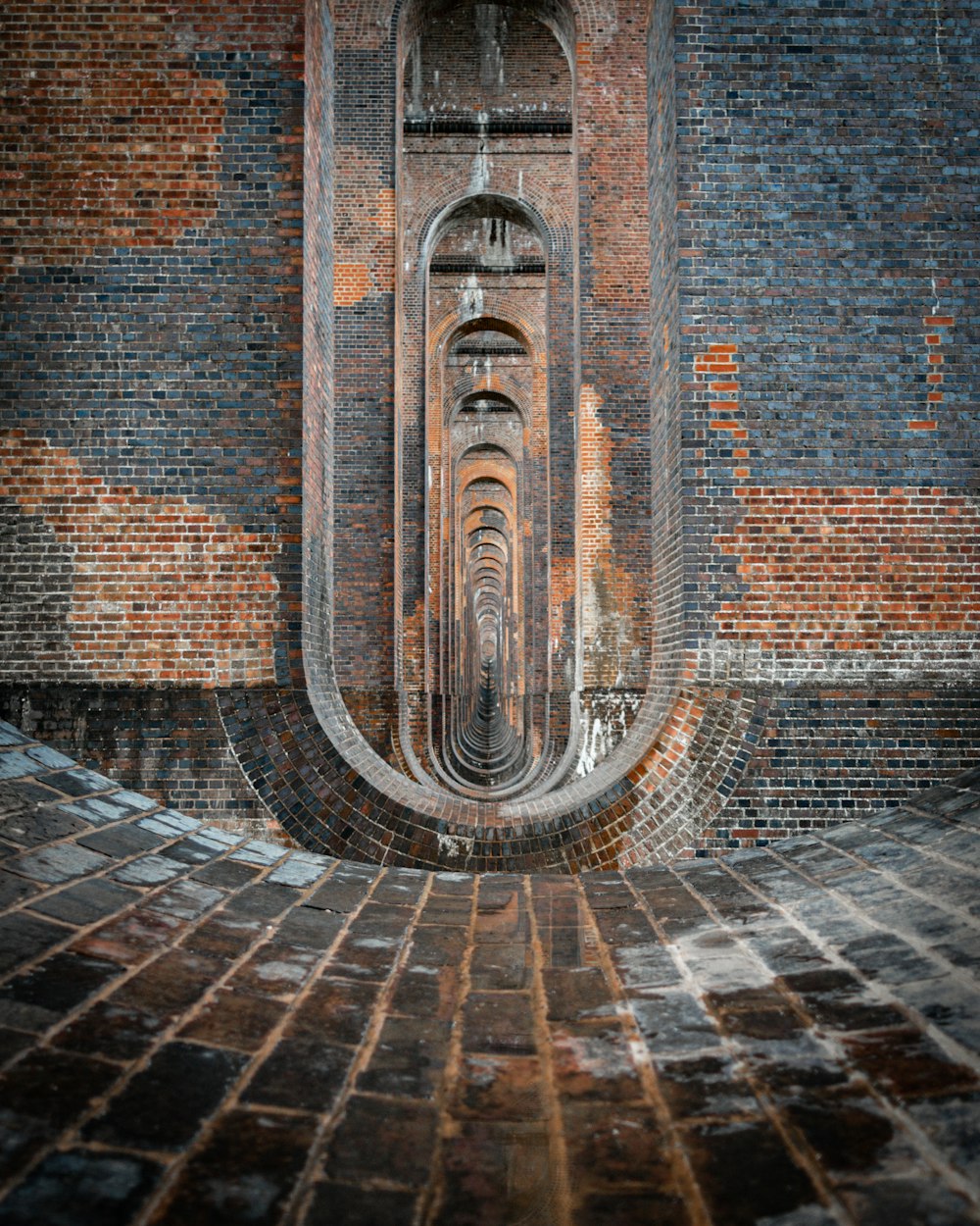 brown brick wall with water fountain