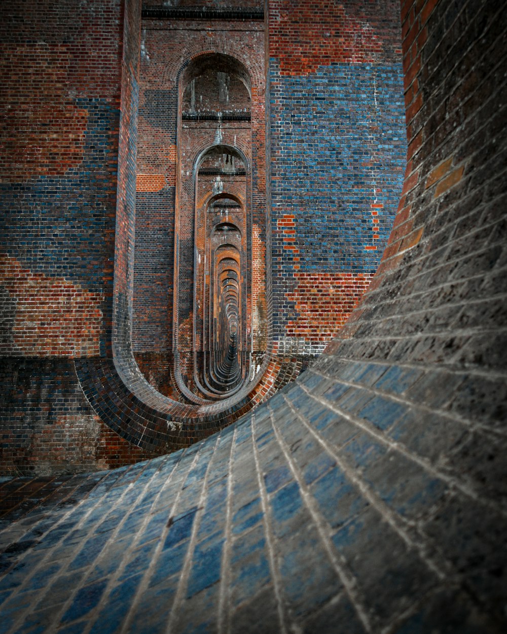 brown and gray brick tunnel