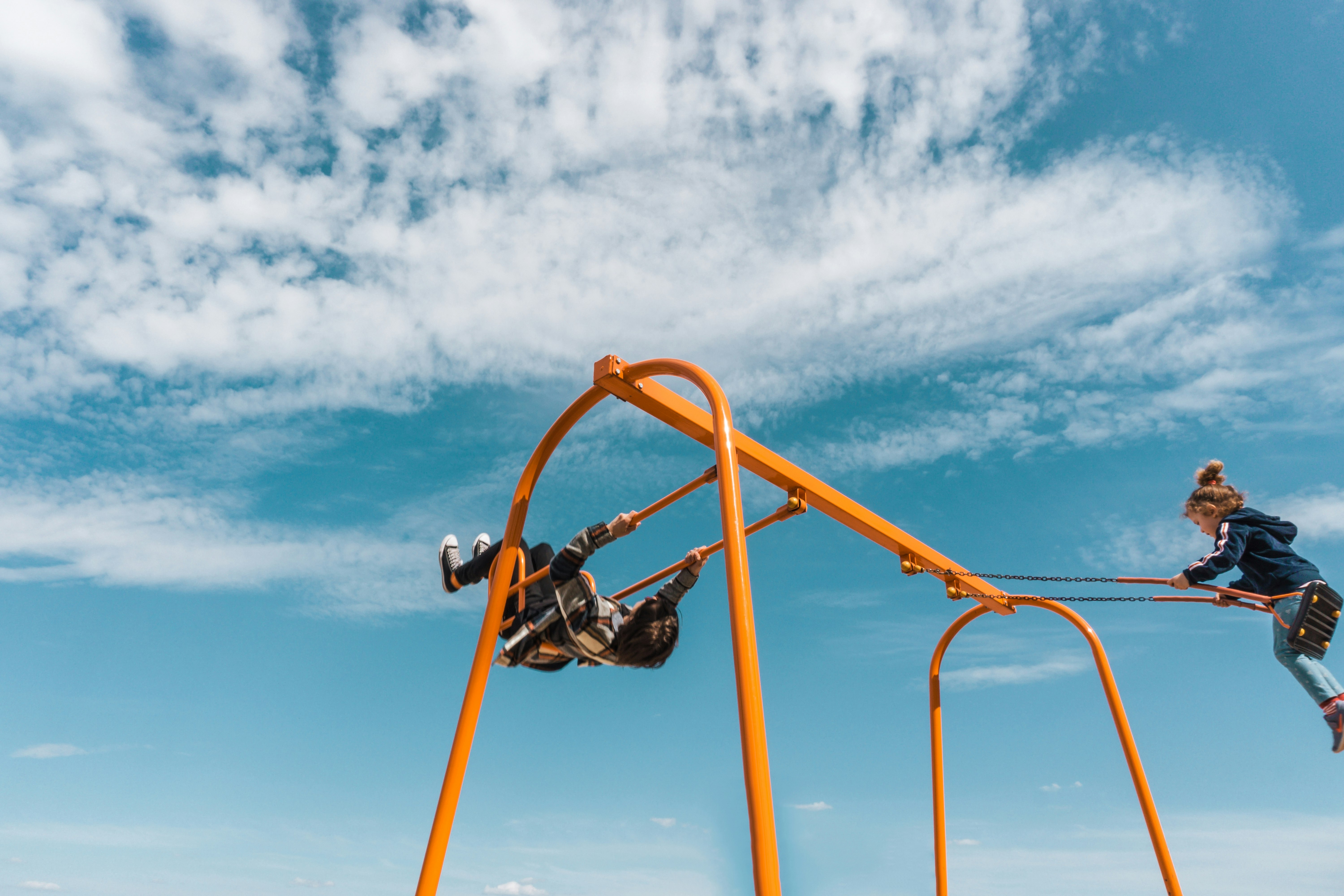 red and yellow metal frame under blue sky during daytime