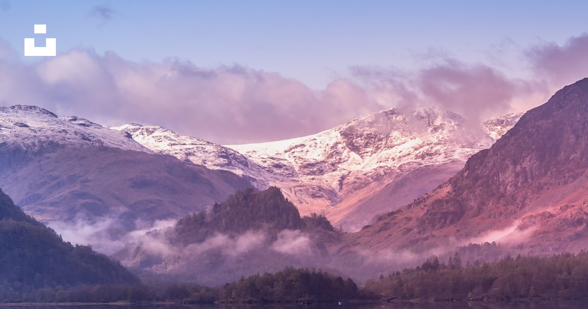 Lake near snow covered mountains during daytime photo Free Uk Image