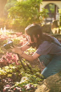 A team member capturing photos of plants during a lively content creation session.