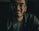 man in black zip up jacket wearing black framed eyeglasses