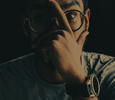 man in black framed eyeglasses