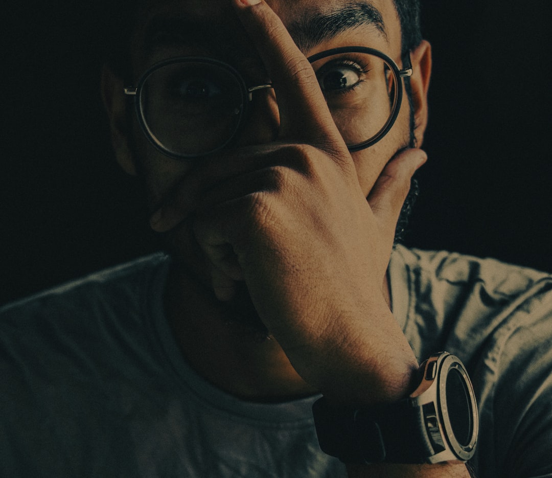 man in black framed eyeglasses,