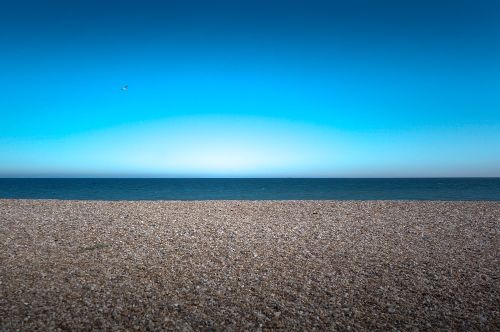 brown sand under blue sky during daytime