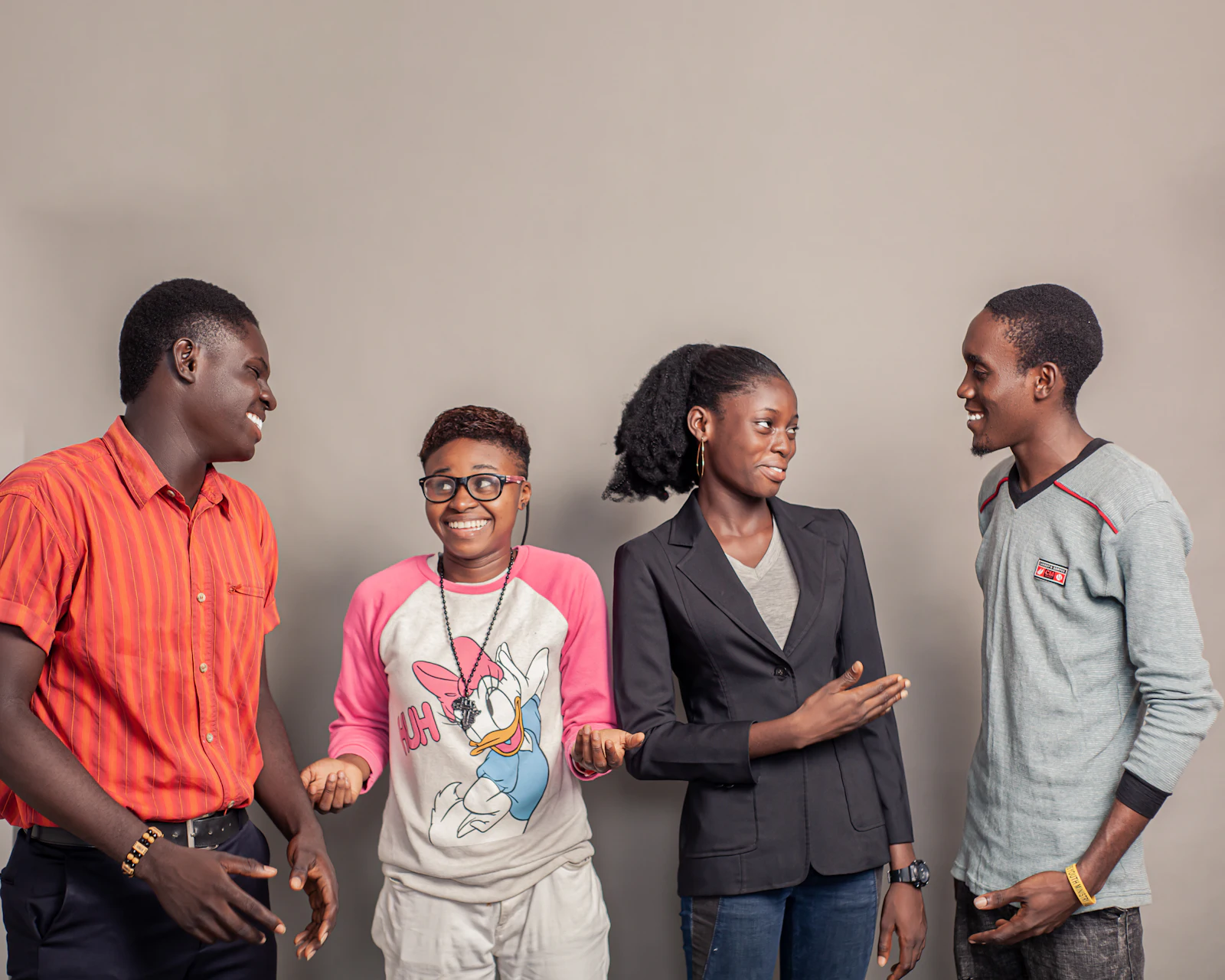 Four young people laughing together
