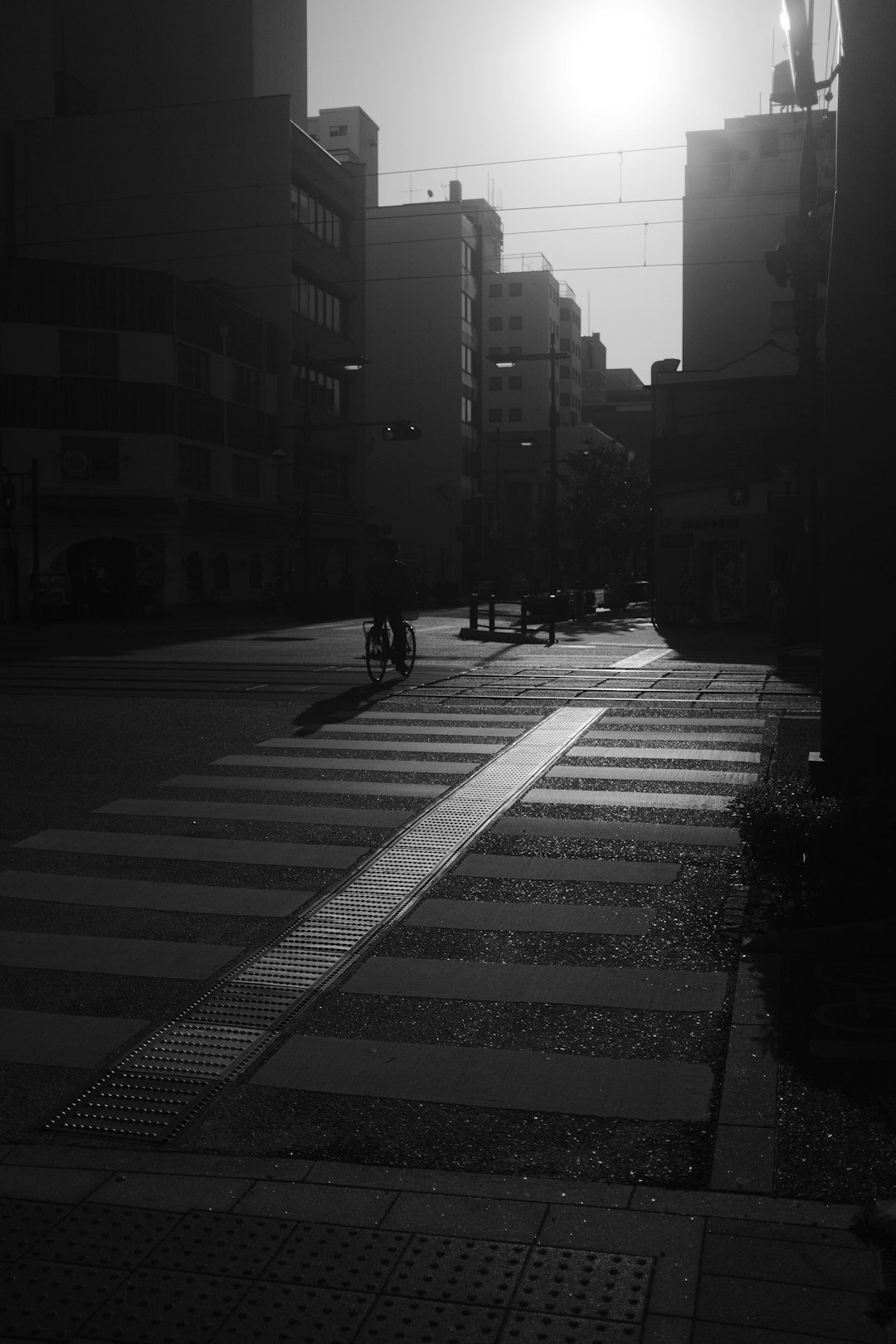 grayscale photo of people walking on pedestrian lane