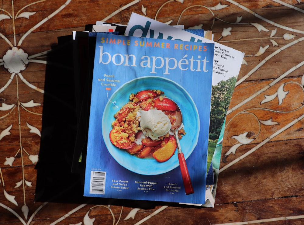 a magazine sitting on top of a wooden table