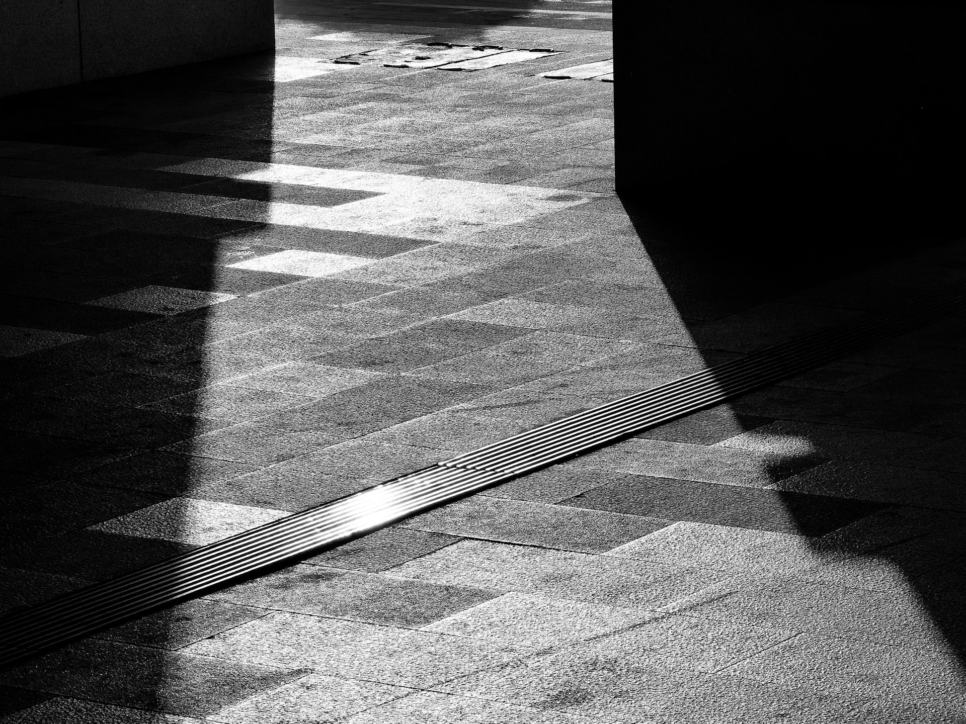 A visually striking photograph taken by a visually impaired artist, showcasing textured patterns and deep shadows.