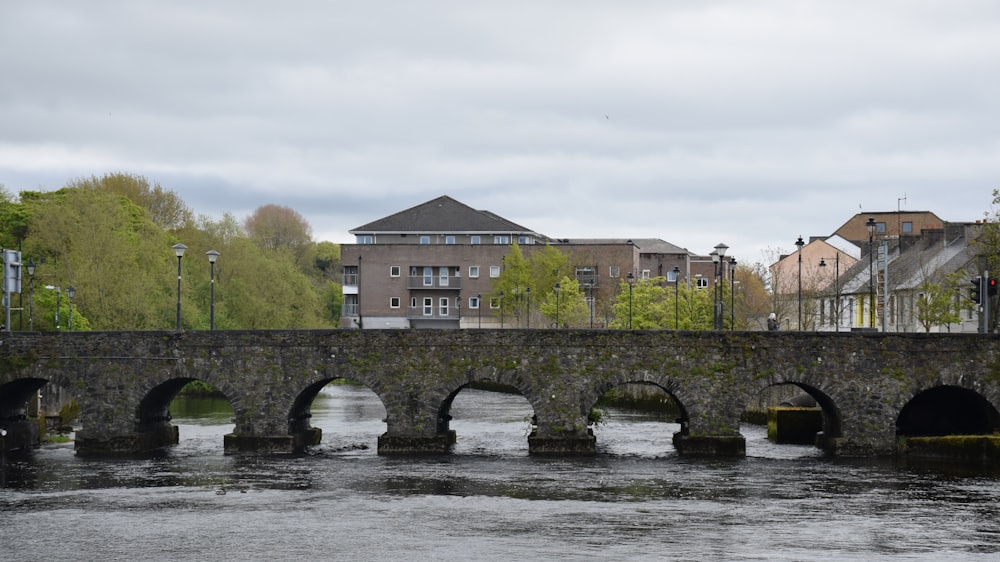 brown concrete building near bridge during daytime