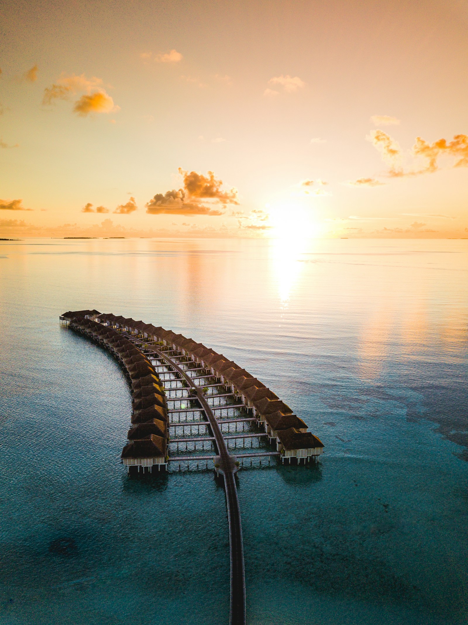Overwater bungalows at sunset, North Ari Atoll
