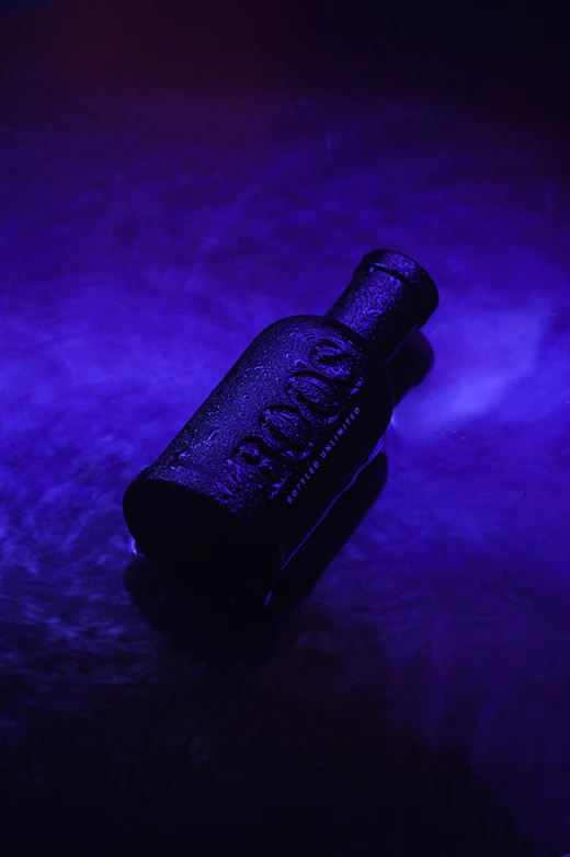 Blue-lit bottle ad