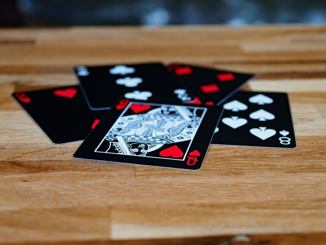 black and white playing cards on brown wooden table