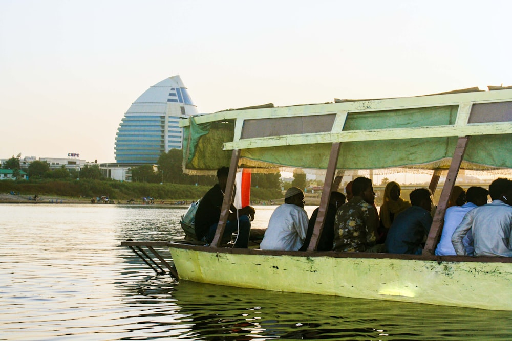 a group of people riding on the back of a boat