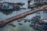 Aerial view of ships docked at a busy harbor.