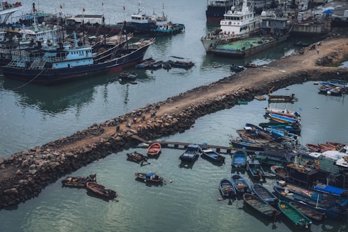Aerial view of ships docked at a busy harbor.