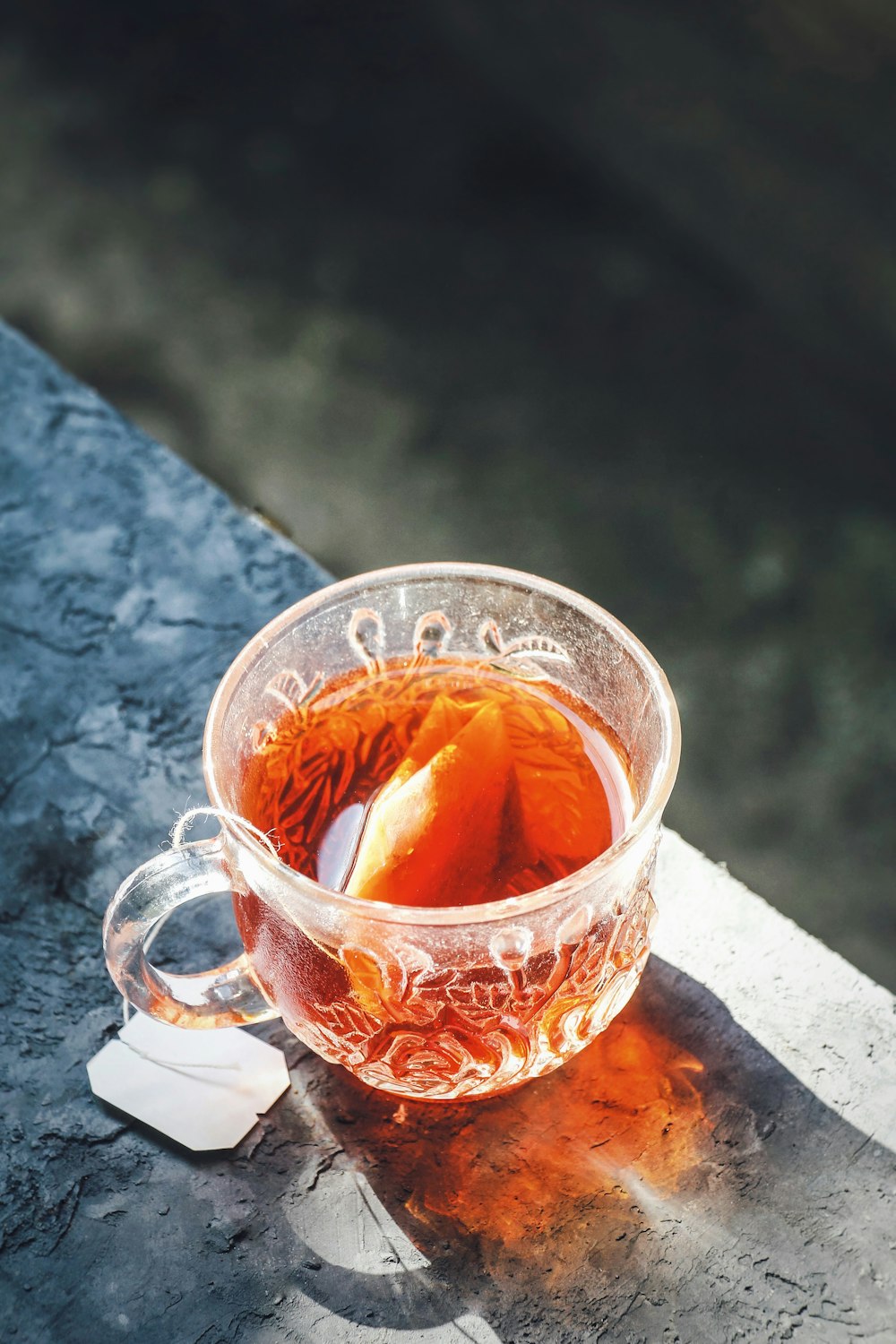 clear glass cup with brown liquid