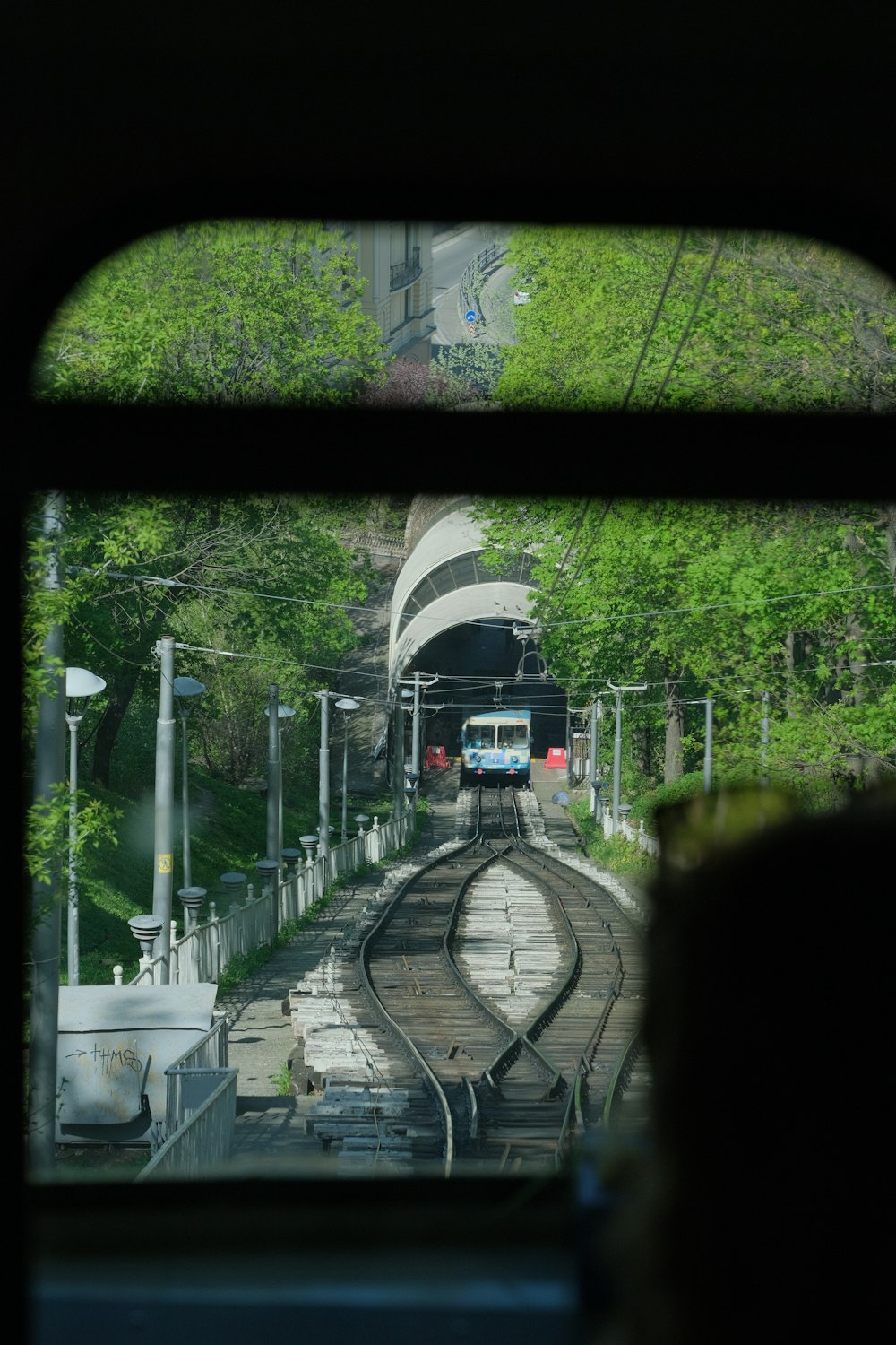 train on rail road during daytime