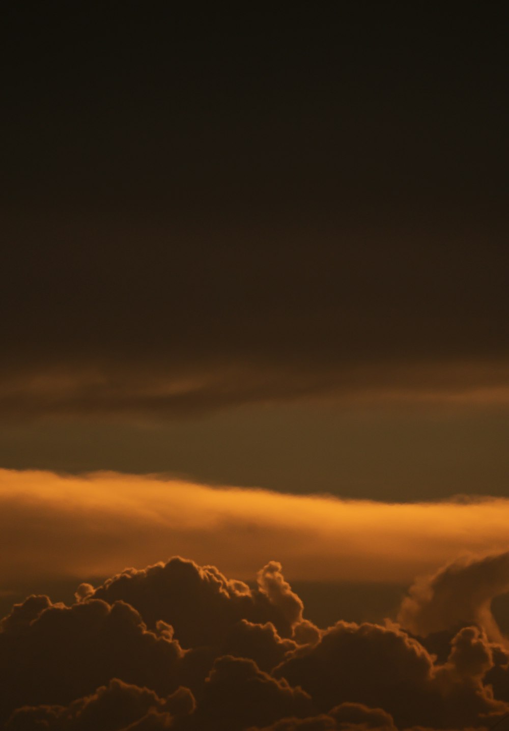 silhouette of clouds during sunset