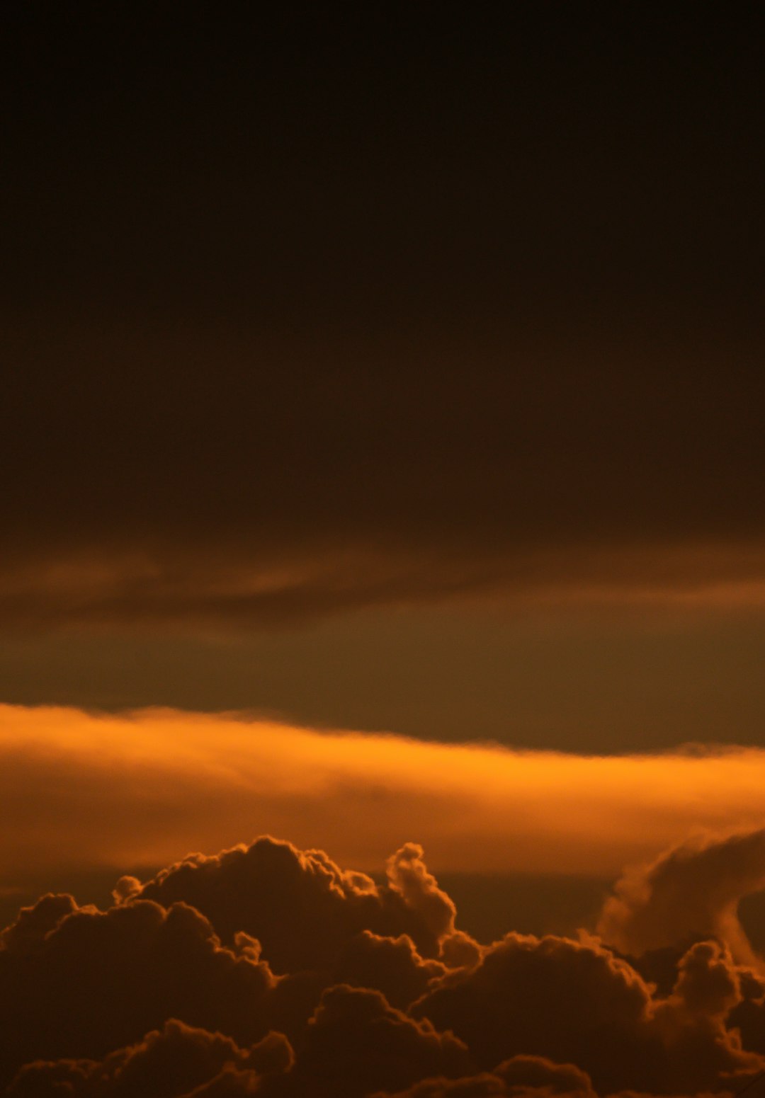 silhouette of clouds during sunset