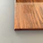Close-up of smooth birch wood grain on a minimalist coffee table with subtle matte finish.
