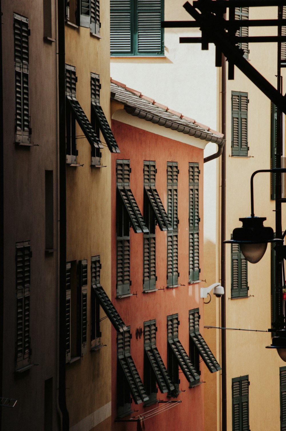 black sconce lamp on brown concrete building during daytime