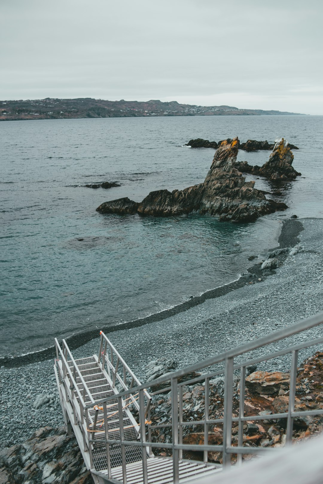 brown rock formation on sea during daytime