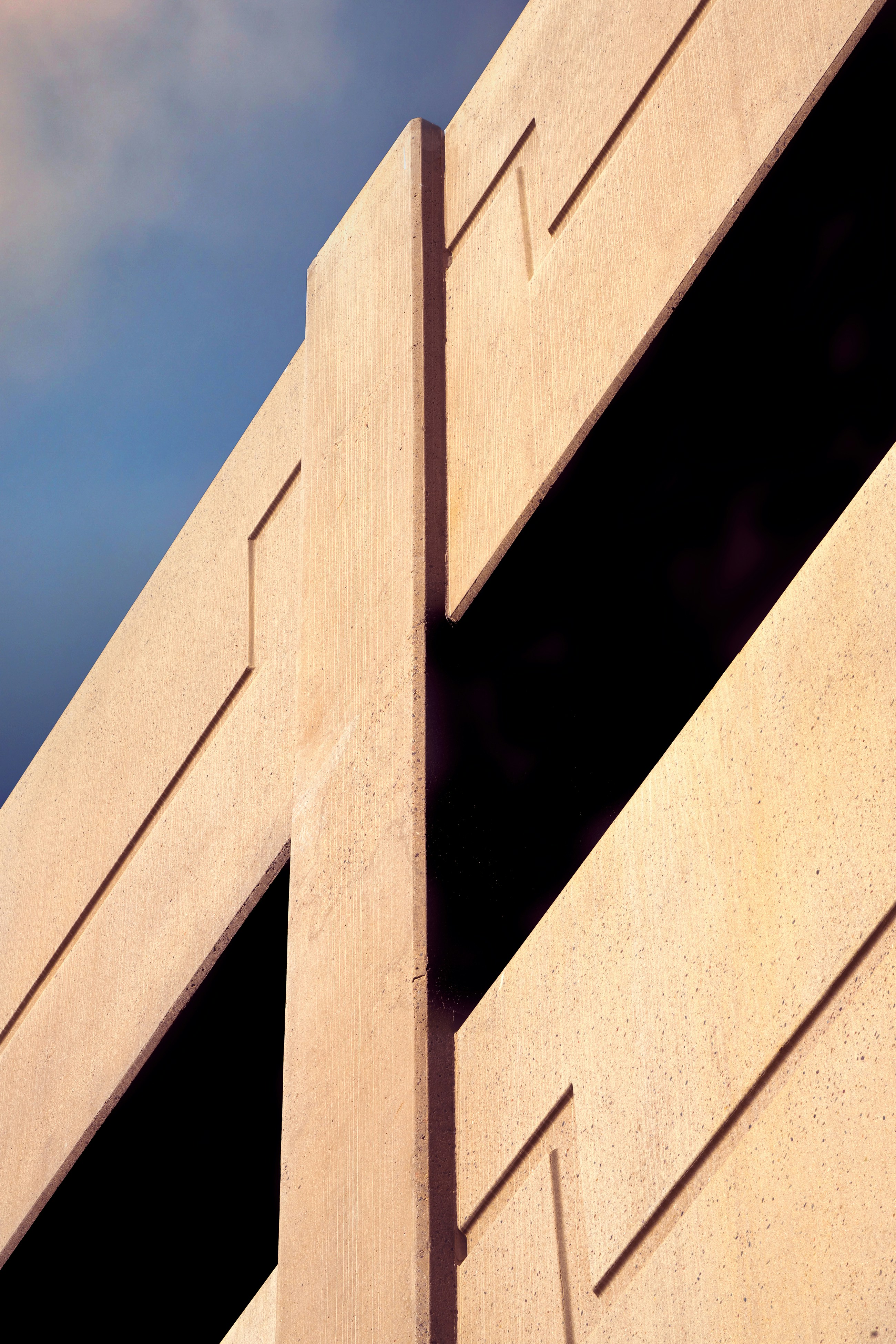white concrete building under blue sky during daytime