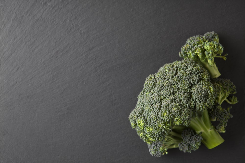 green broccoli on brown wooden table