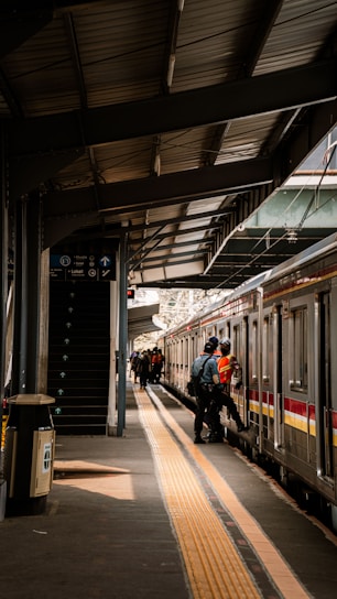 people in train station during daytime