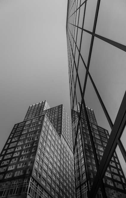 grayscale photo of high rise buildings