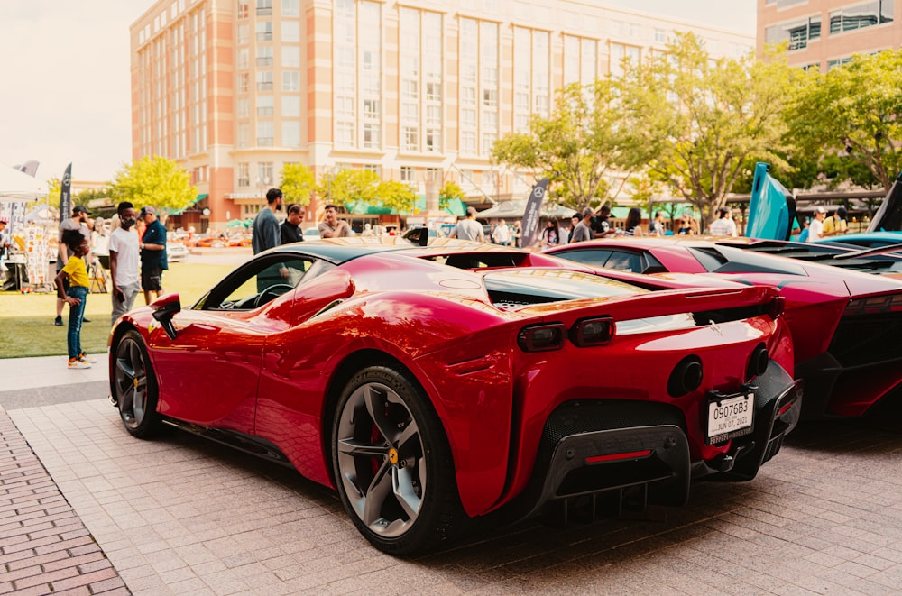 red ferrari 458 italia parked on street during daytime