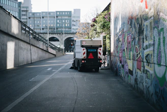 white and red truck on road during daytime